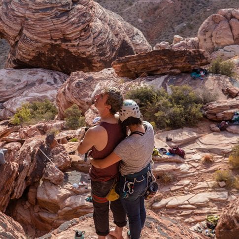 a romantic climbing couple at red rocks