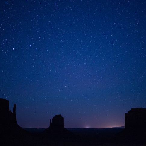 monument valley at night with starry sky