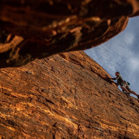 man climbing at red rocks in nevada